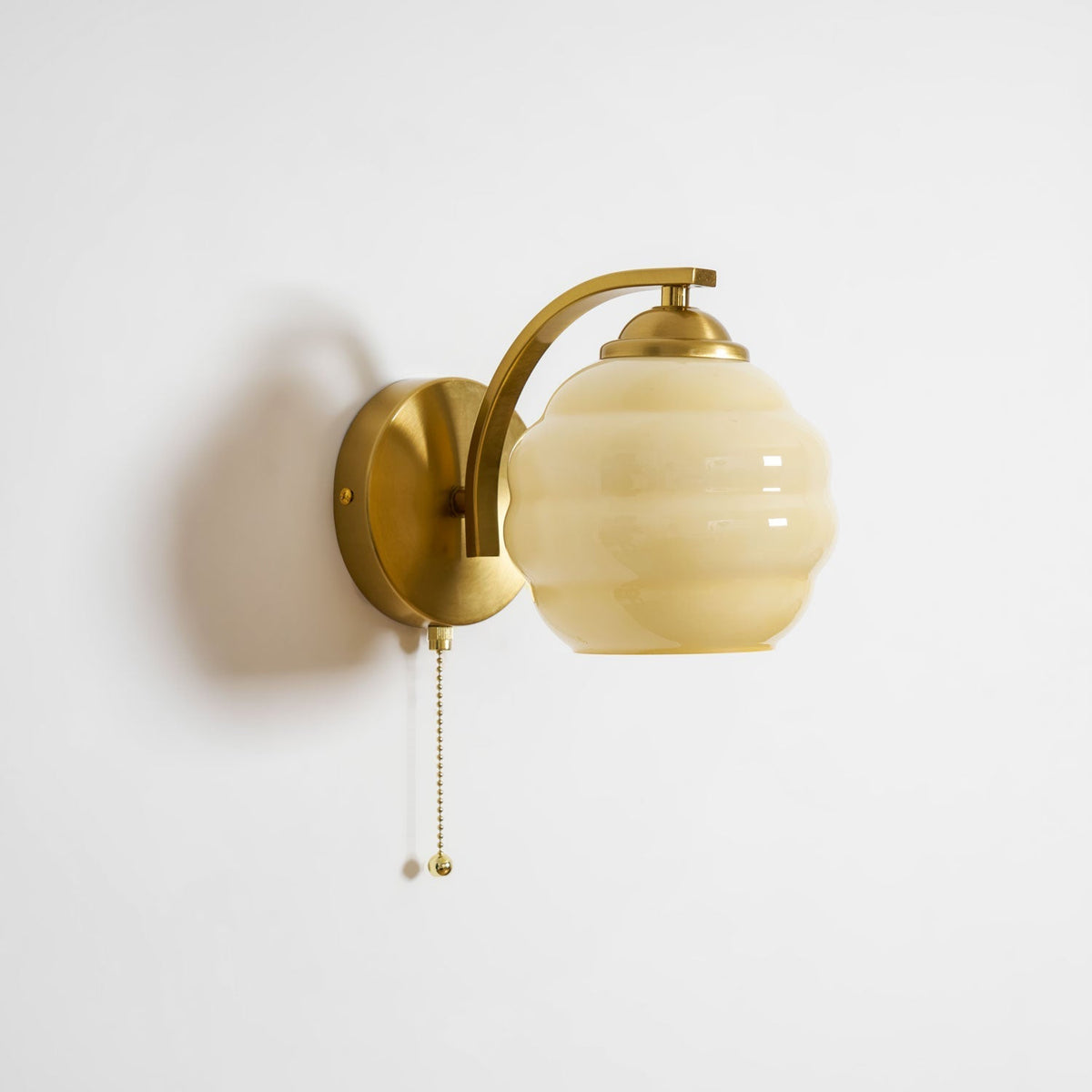 Scalloped Glass Wall Sconce with Ribbed Shade and Metal Backplate