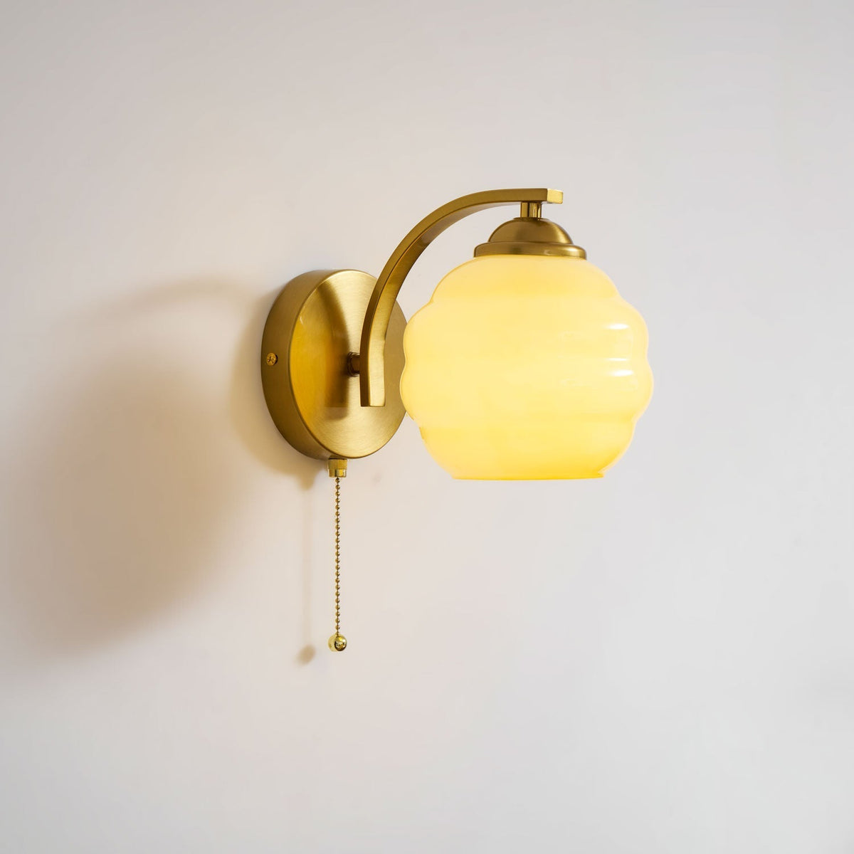 Scalloped Glass Wall Sconce with Ribbed Shade and Metal Backplate